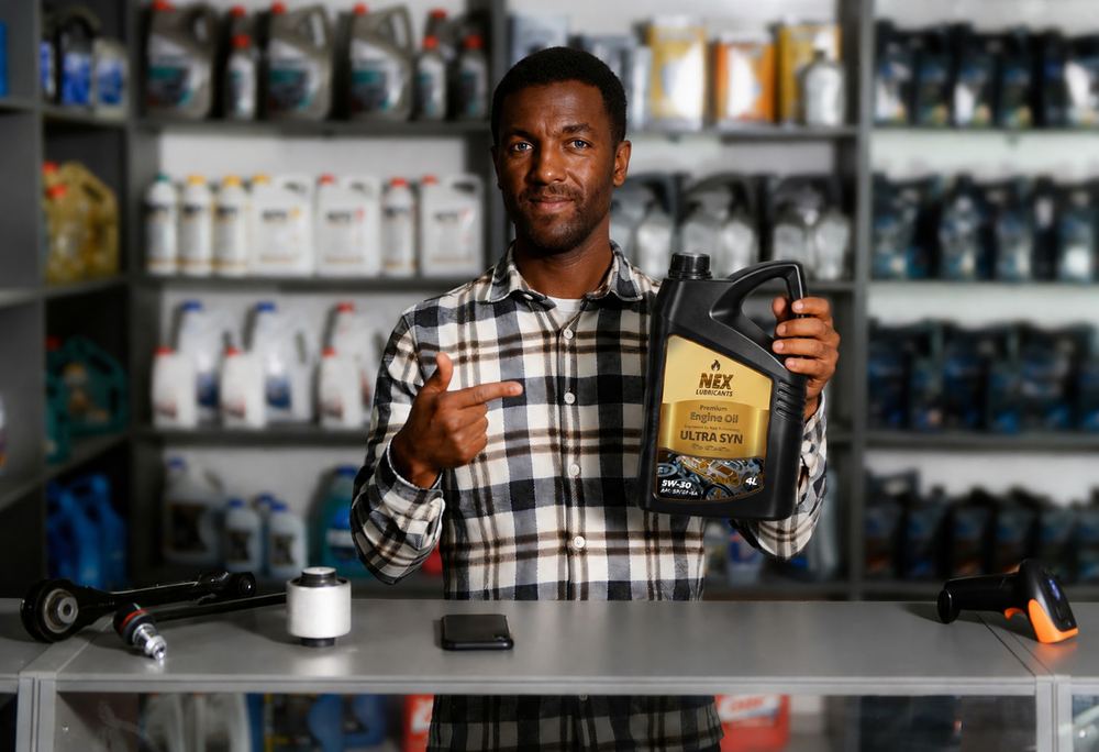 NEX distributor holding NEX Ultra Syn engine oil